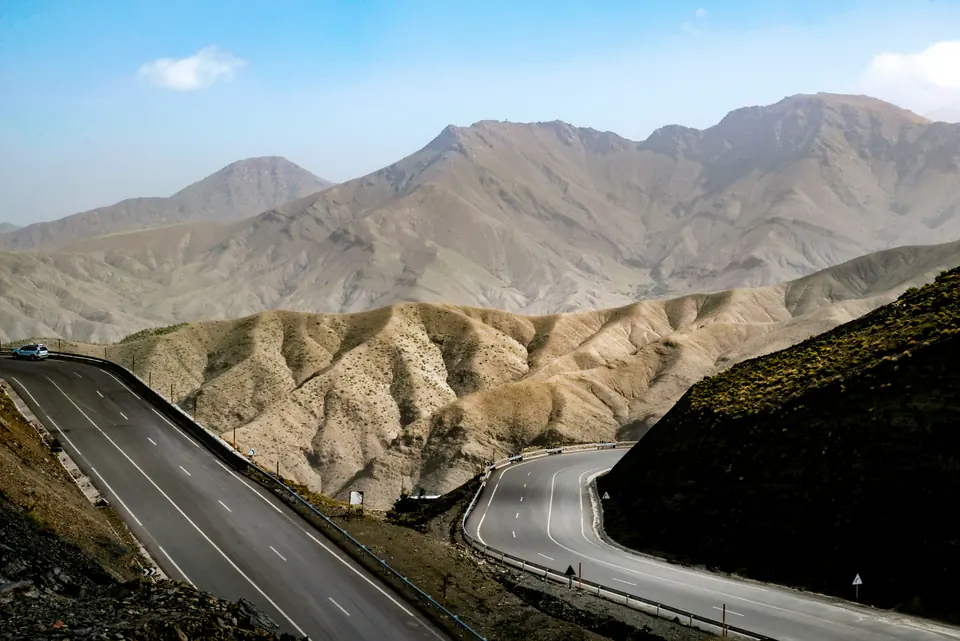 A road winding through the bare ridges of the High Atlas