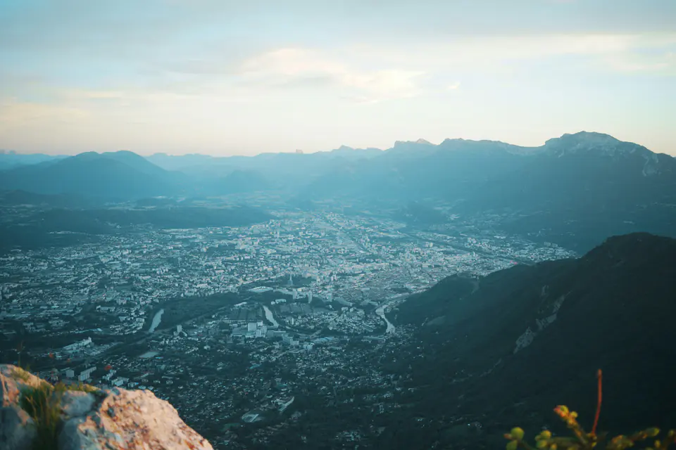 The Grenoble basin and its mountains at dusk, seen from the cliffs of the Chartreuse