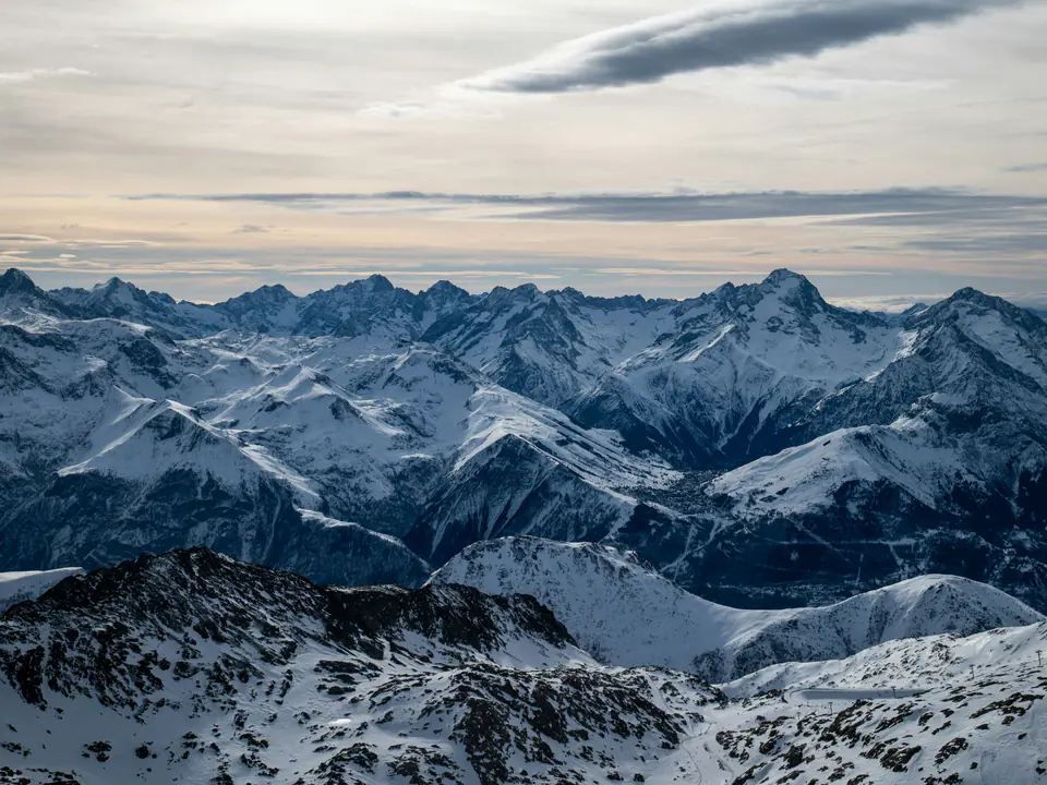 The snowy Oisans peaks, seen from high above Alpe d’Huez