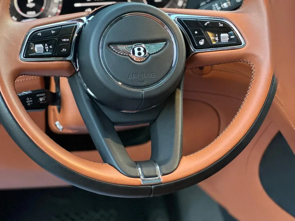 Driver controls inside a real Accrocar Bentley in Marrakech