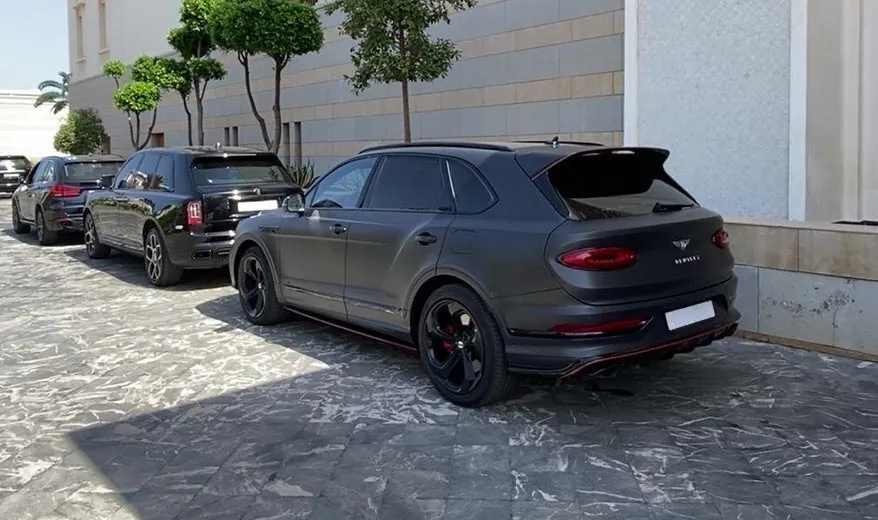 Bentley Bentayga parked in a hotel forecourt in Rabat, rear three-quarter view